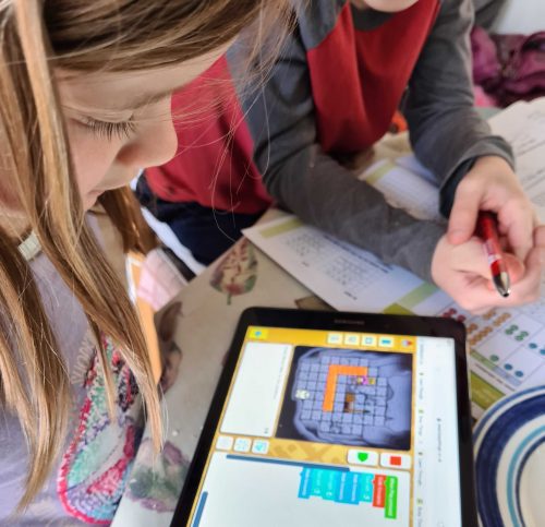 A girl doing digital making on a tablet